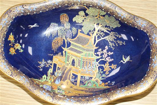 A Carltonware thirty five piece coffee and dessert service, with chinoiserie decoration on a dark blue ground